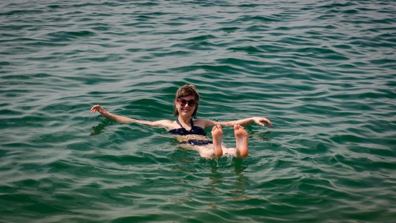 Woman floating in the Dead Sea