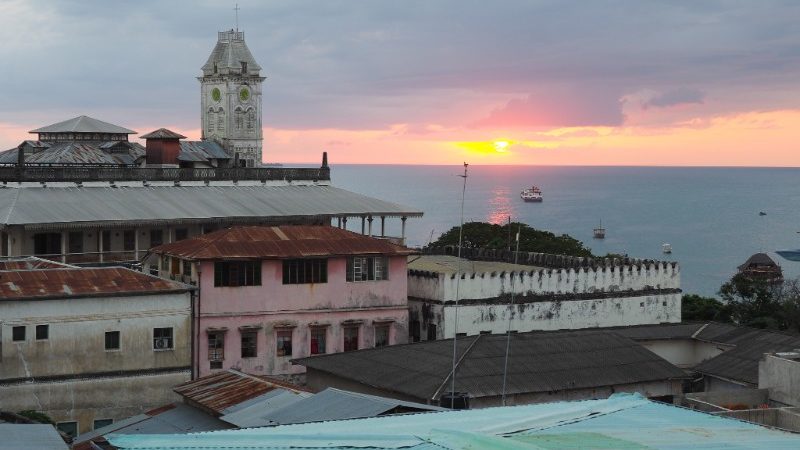 View of roofs and ocean