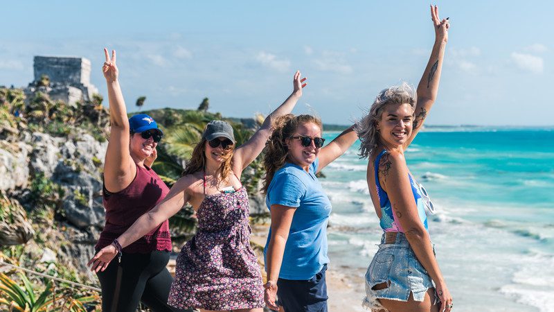 Four smiling girls in Tulum, Mexico