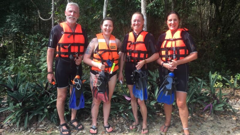 Four divers getting ready to swim