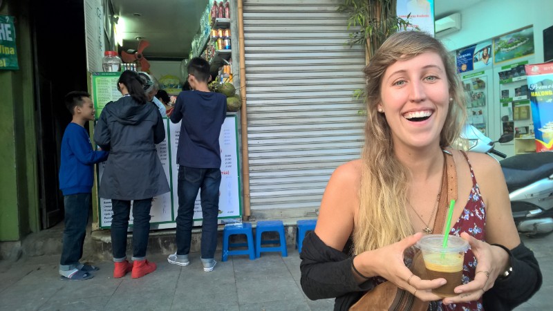 Girl drinking an egg coffee in Hanoi