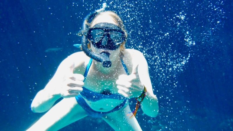 Woman snorkelling in Tulum cenote