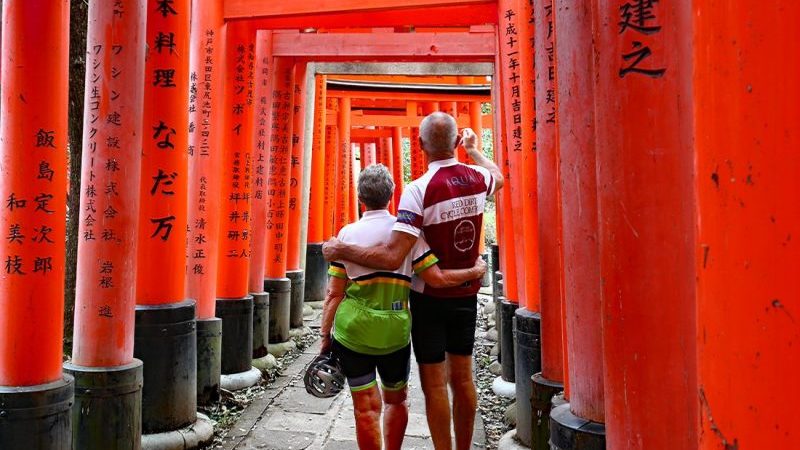 Two cyclists in the Fushimi Inari-Taisha shrine