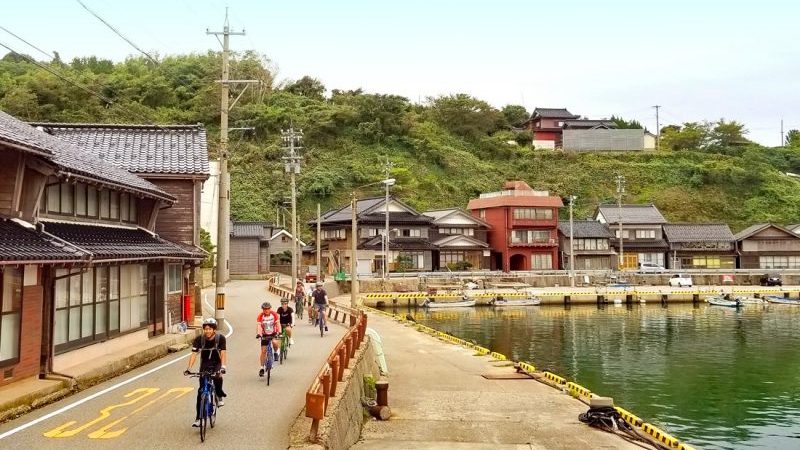 Cyclists in a small town in Japan