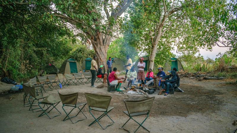 Travellers sitting around at a bush campsite