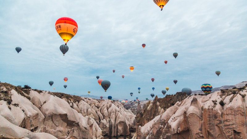 Hot air balloons above valley in Cappadocia