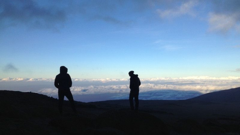 Two hikers on top on Mt Kilimanjaro