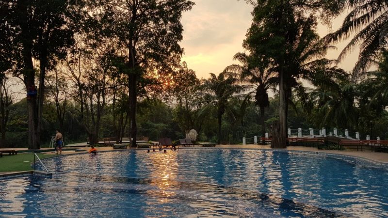 A beautiful swimming pool at dusk.