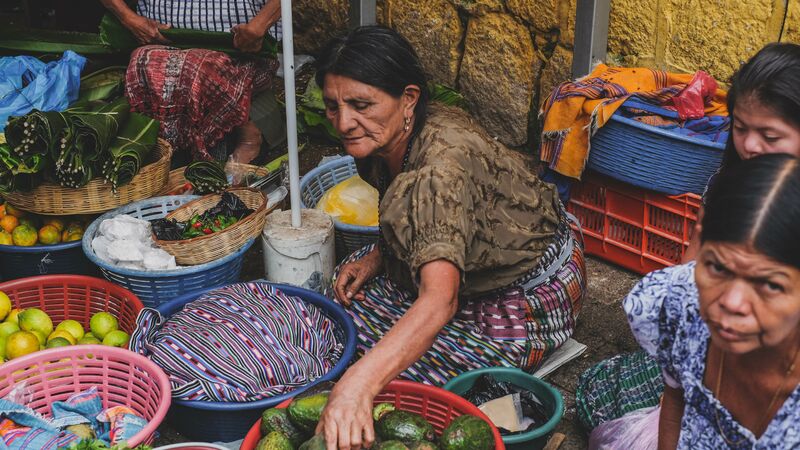 A woman selling vegetables at the market