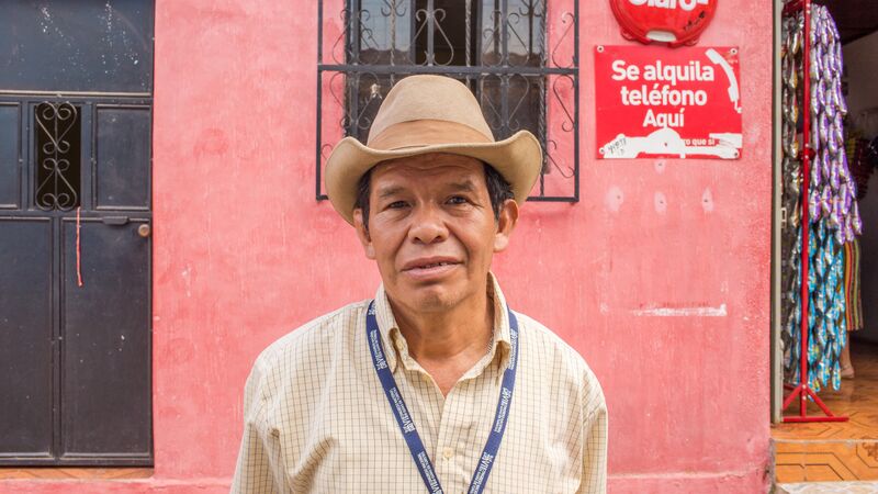 A man in a cowboy hat in Lake Atitlan