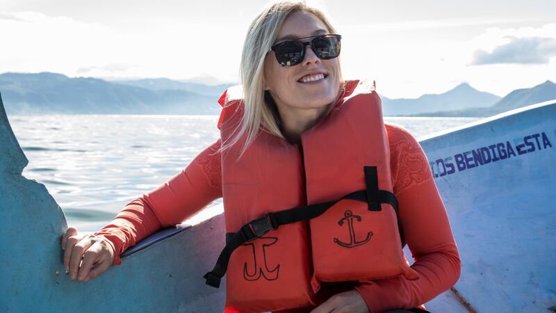 Smiling woman in a boat