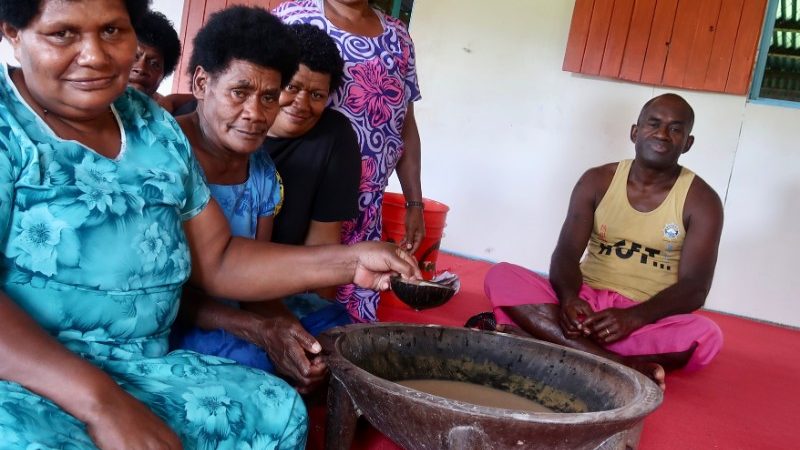 Fijians sitting around a kava bowl