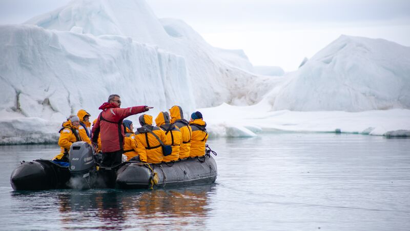 Travellers on a Zodiac in the Arctic