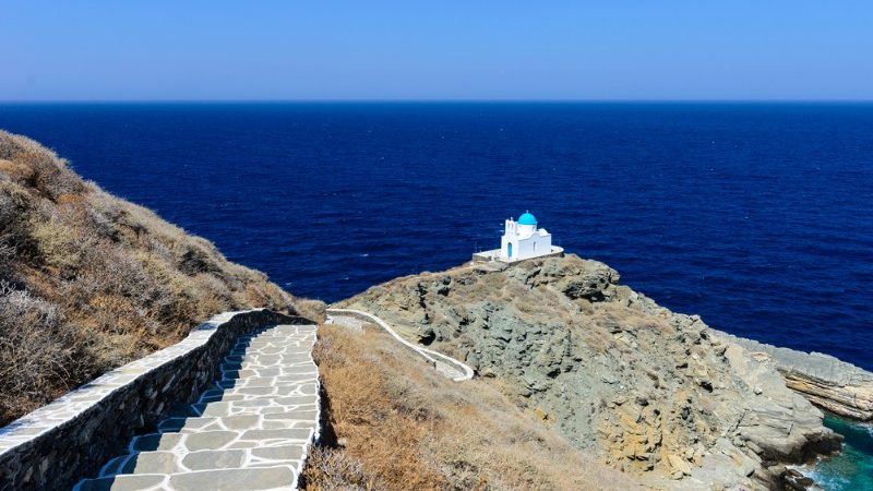 An old church on the edge of a cliff overlooking the ocean