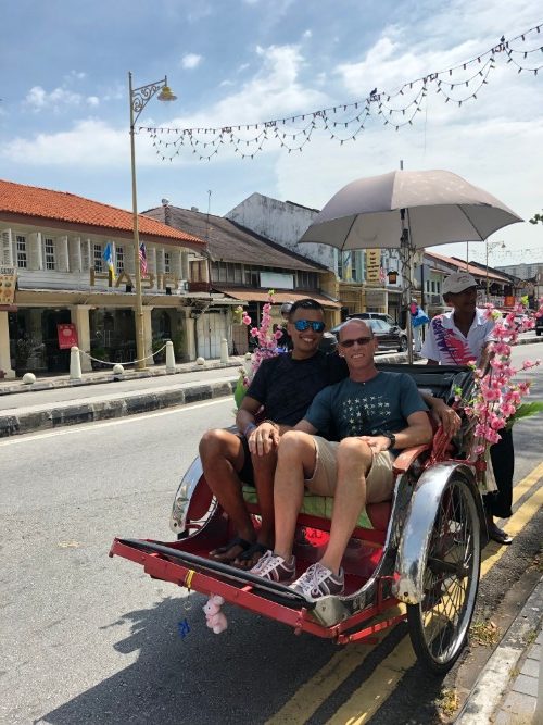 Two men on a cyclo in Thailand