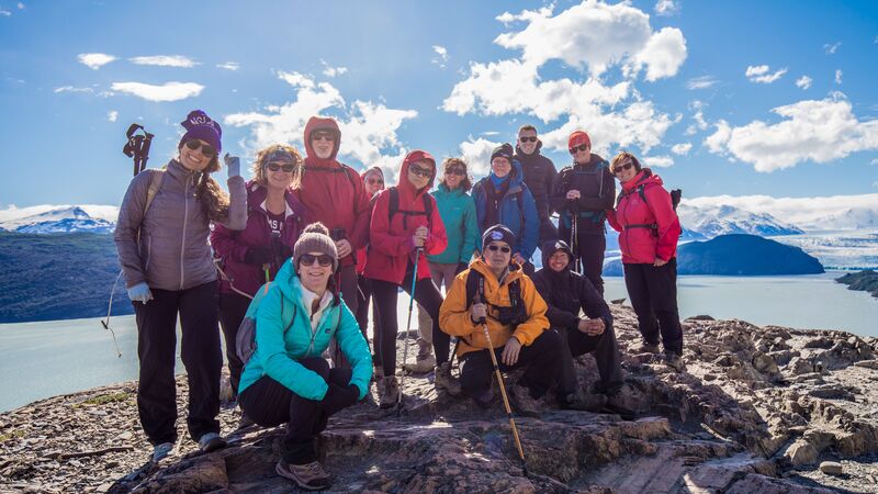 A group of trekkers posing for a photo in Patagonia, Chile