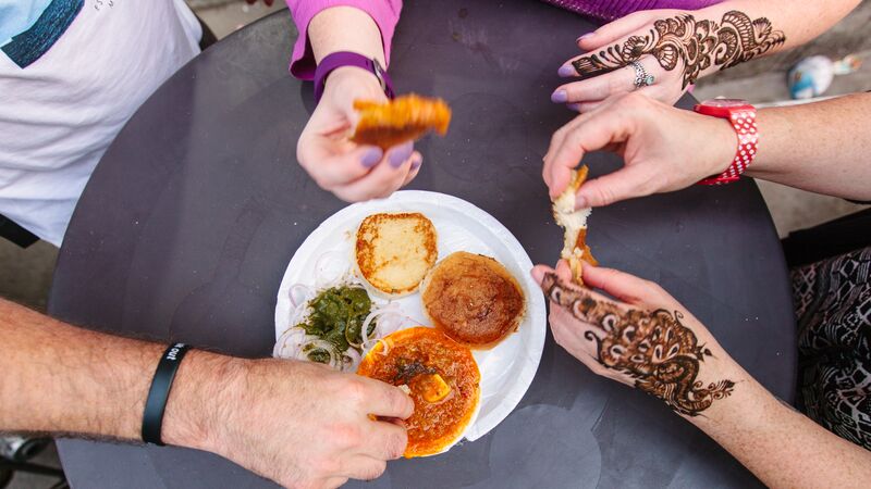 People eating street food in India