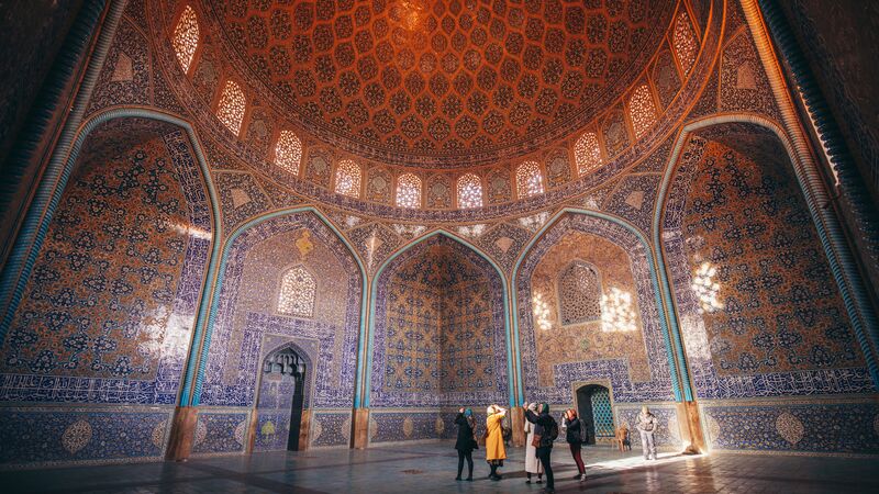 A group of female travellers in a beautiful mosque in Iran