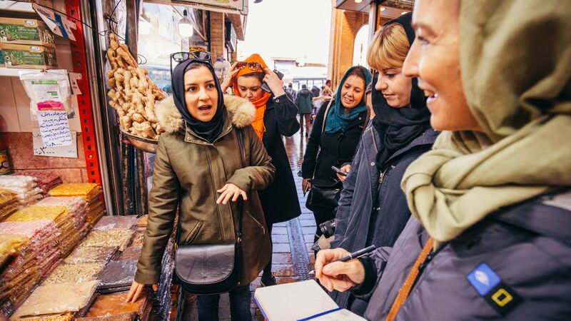 A group of female travellers at the market in Iran