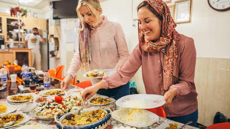 Two happy women at a cooking class in Iran