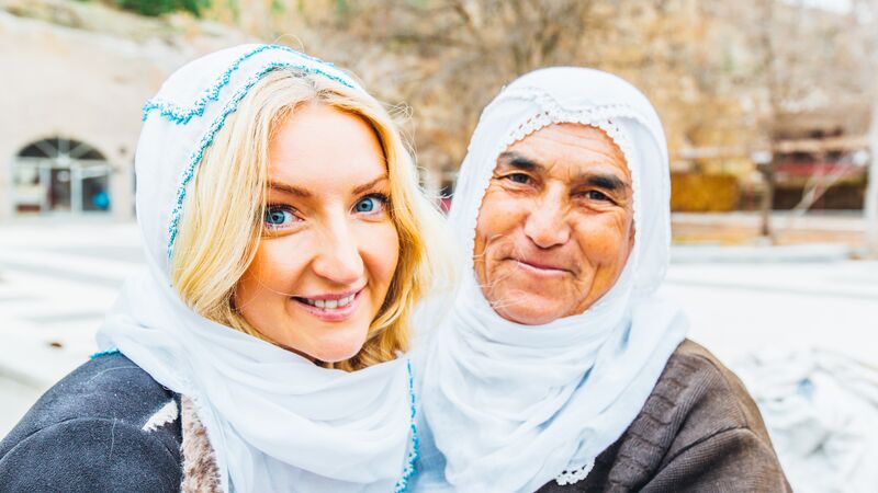 A traveller and a local woman in Turkey