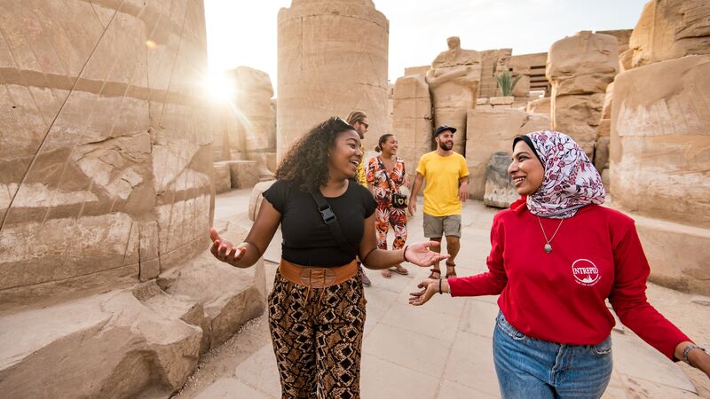 A tour guide shows a traveller around Egypt
