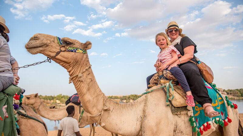 A mum and her daughter on a camel in Egypt