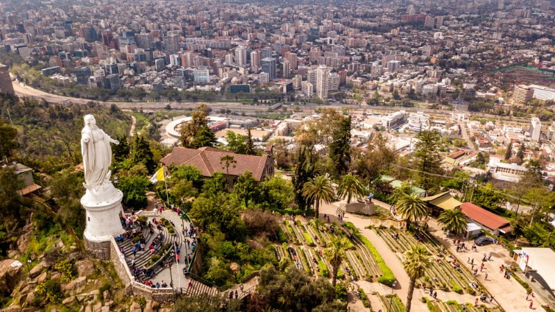 A white statue on a hill in Santiago