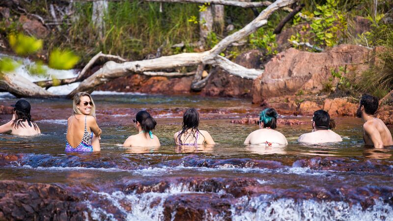 A group of swimmers in a rockpool in Litchfield.