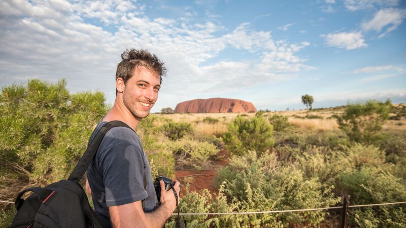 A smiling man at Uluru.