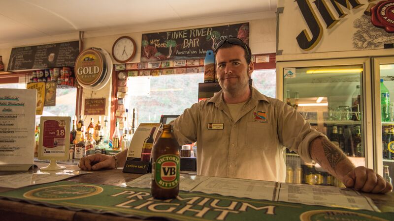 A man serves a beer in a pub