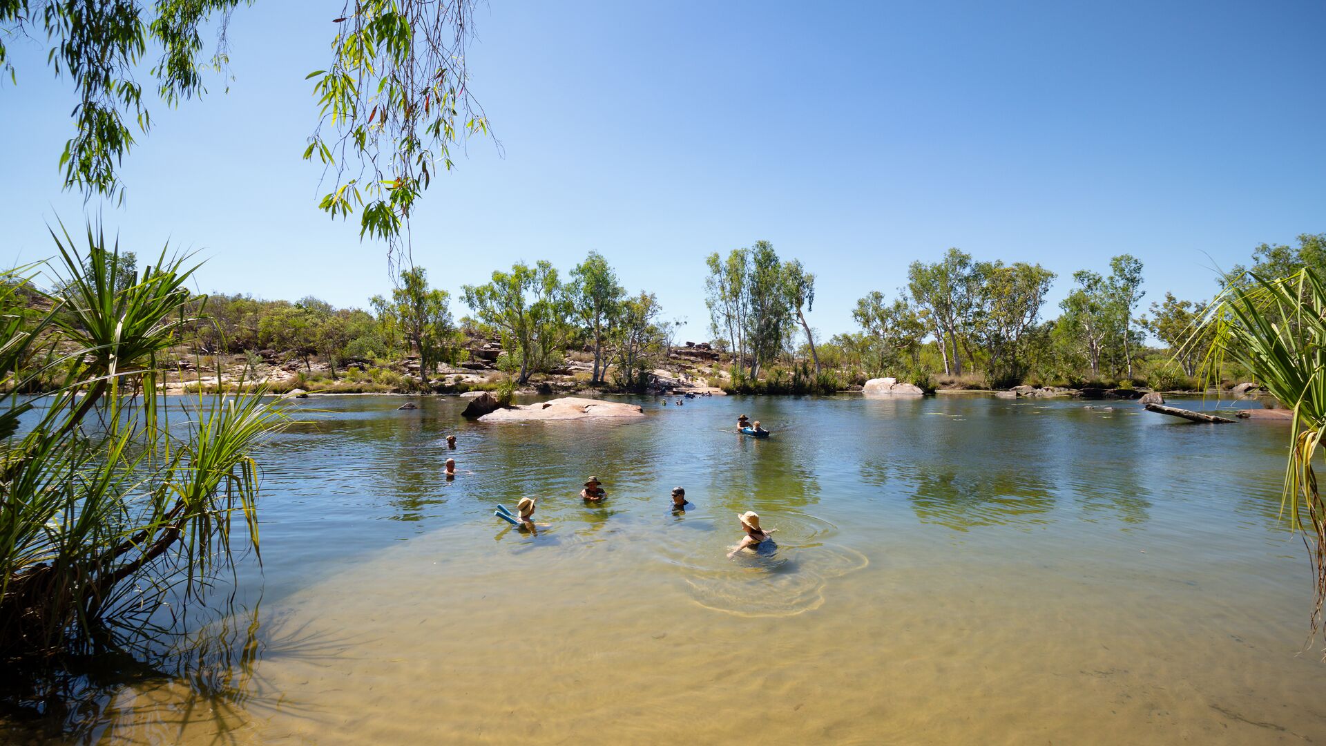 Swimmers in Mount Barnett Station watering hole.