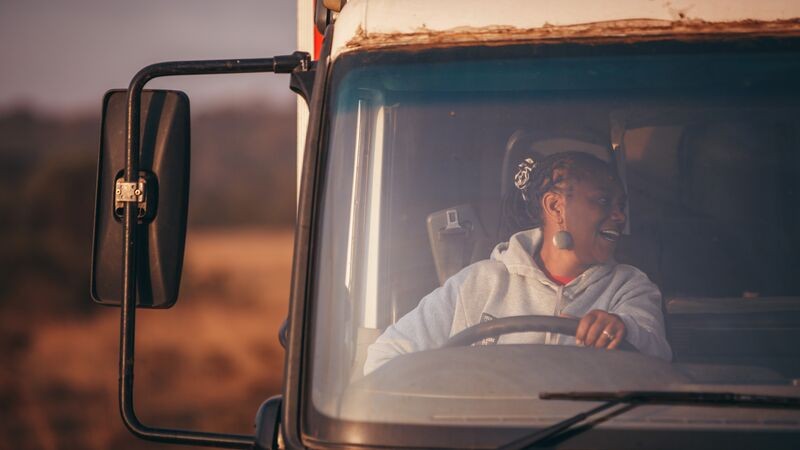 Becky driving her truck.