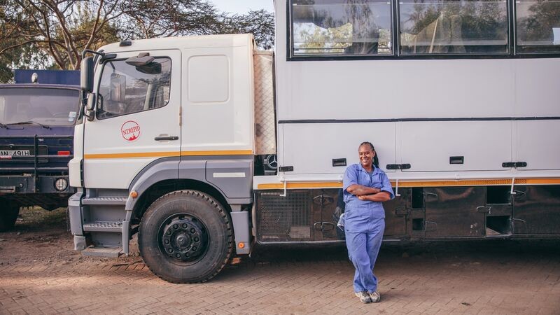 Becky standing in front of her truck