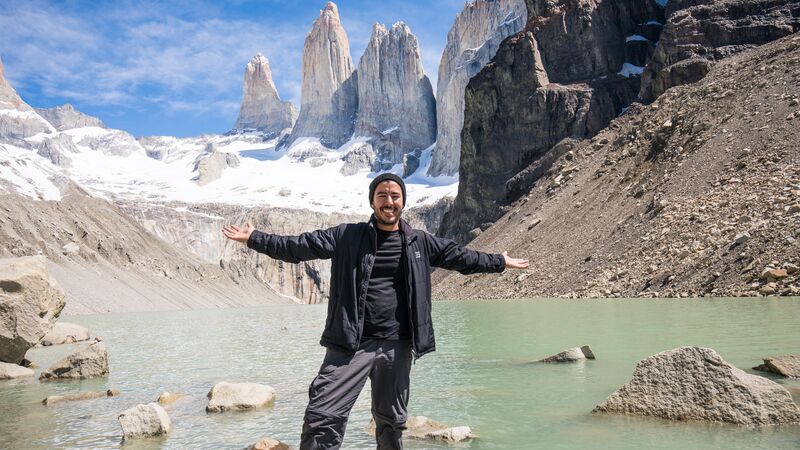 A man stands in front on Patagonia's famous granite mountain shards