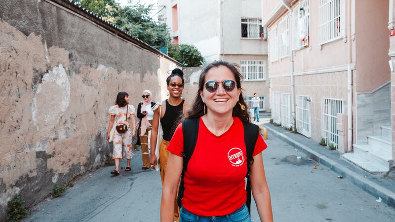 A group of travellers walking through Istanbul.