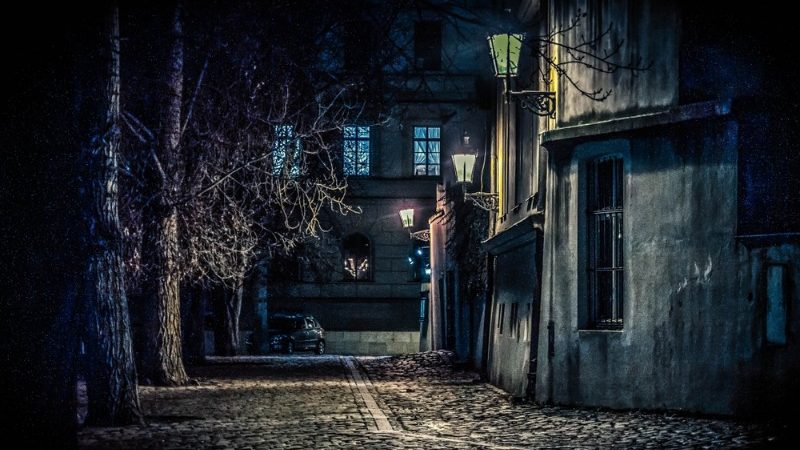 A dark street in Prague at night