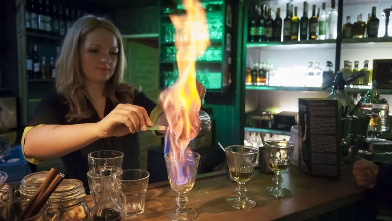 A girl prepares Absinthe in the Czech Republic