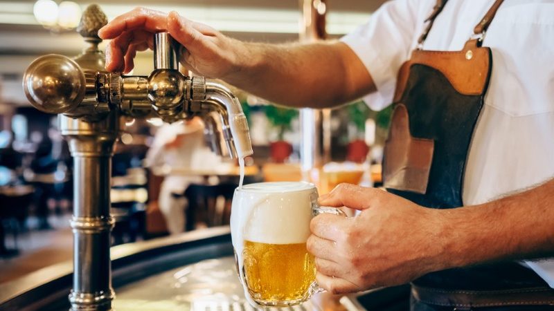 A man pouring a beer in the Czech Republic