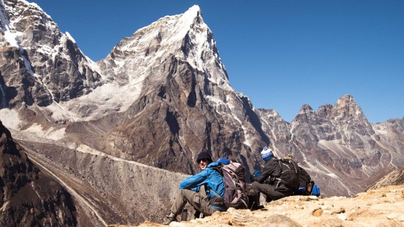 Two people under the peaks of Everest