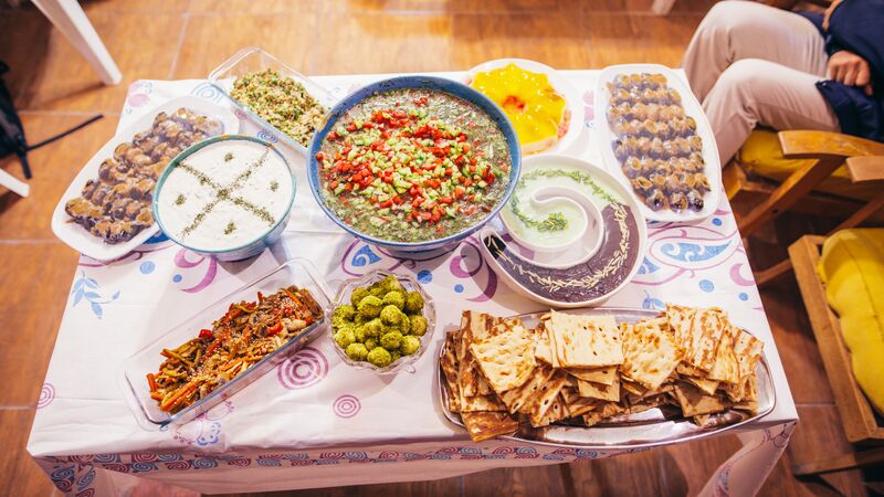 A table laden with Iranian food