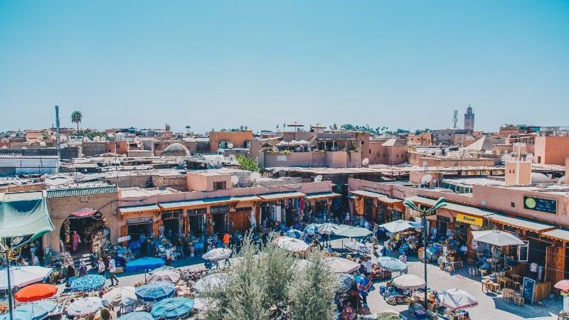 A clusters of umbrellas and market stills in Marrakech.