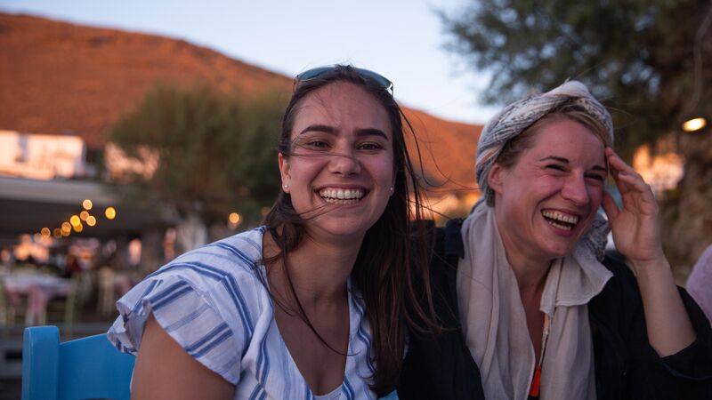 Two smiling travellers in Greece.