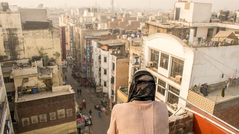 Woman standing on a roof in Delhi