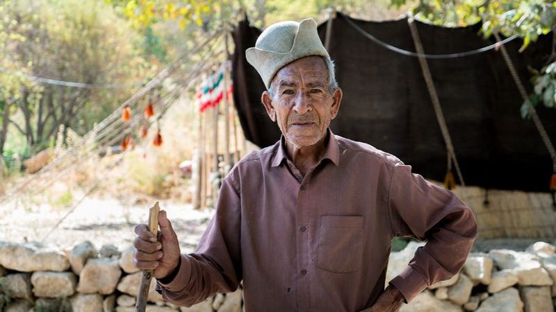 A nomad in a front of a tent in Iran.