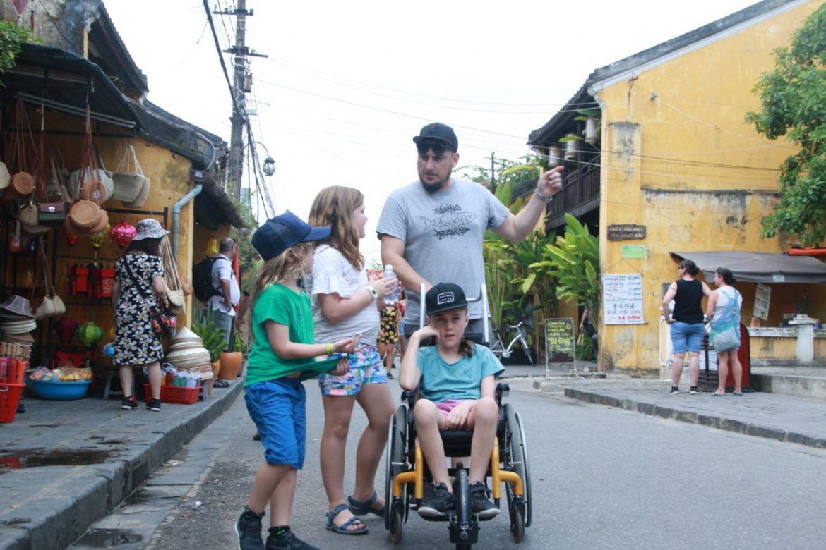 Three kids with their Dad in Vietnam