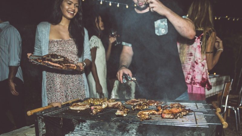 Two people at a barbecue