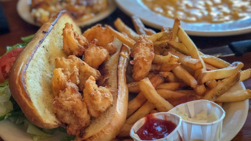 Sandwich filled with fried oysters on a plate