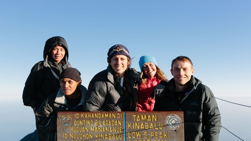 A group of hikers on the summit of Mt Kinabalu