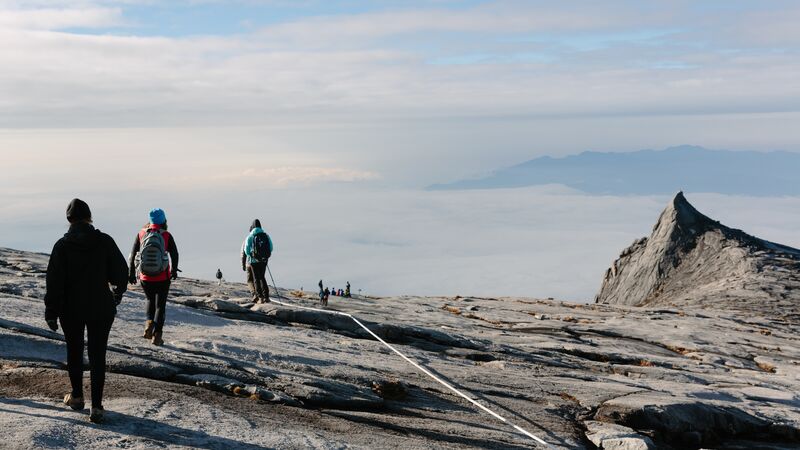 Hikers at the via ferrata on Mt Kinabalu